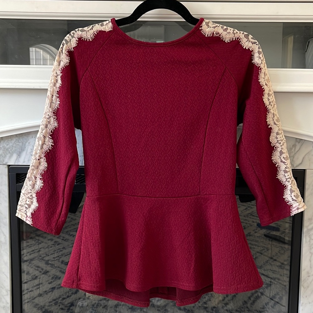 peplum lacey arm top